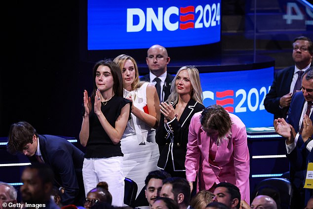 From left: Natalie Biden, Finnegan Biden, Melissa Cohen and Maisy Biden stand and applaud before President Joe Biden's appearance Monday night at the Democratic National Convention.