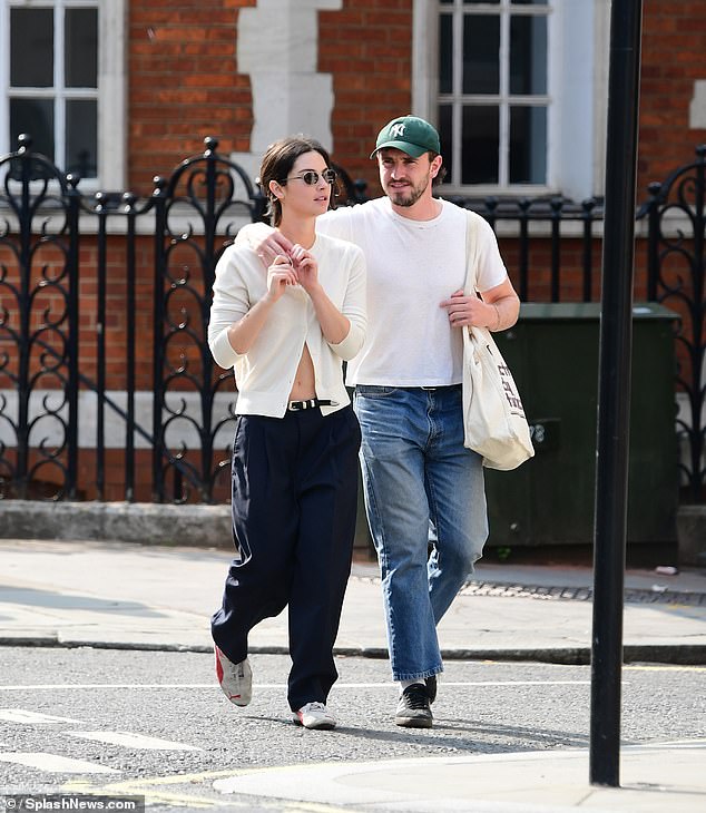 In an exclusive video from MailOnline, the couple are seen looking happy and relaxed in each other's company as they stroll down the street together.