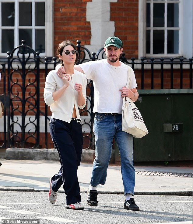 Not being shy about their blossoming romance, the duo put on a display of affection as they chatted happily and smiled together.