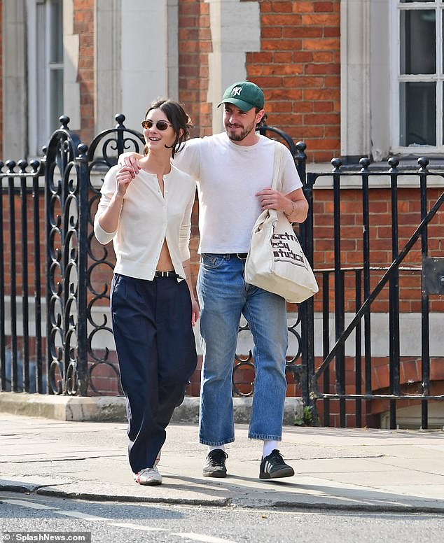 Paul looked happier than ever as he strolled with Gracie.