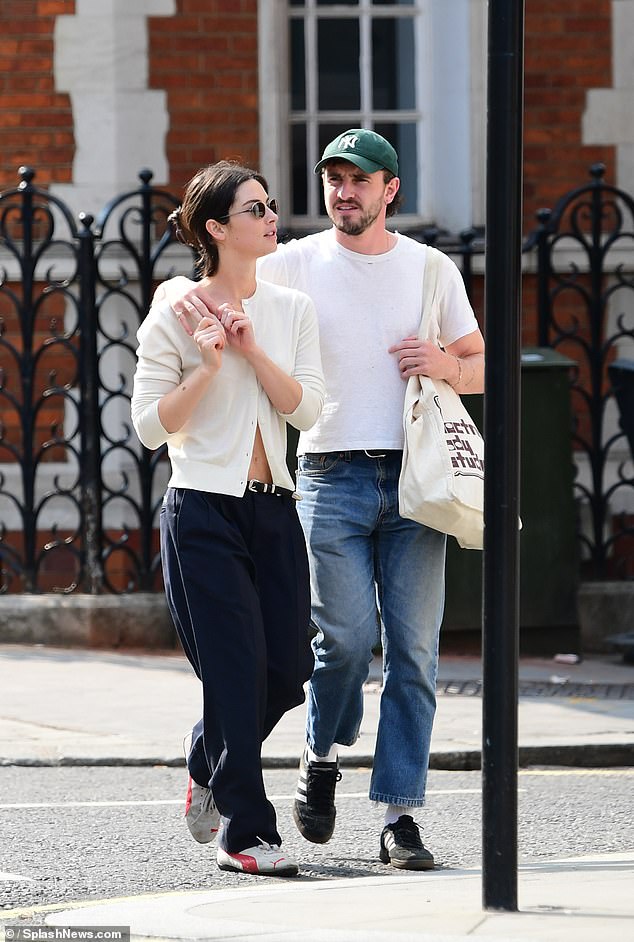 The Normal People star kept it casual for the day, wearing a smart white T-shirt and blue jeans, which she paired with a green New York Yankees baseball cap.