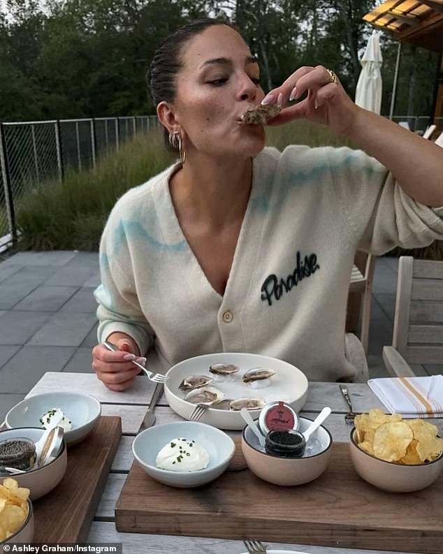 Graham also shared a photo her husband took of her eating raw oysters and caviar.