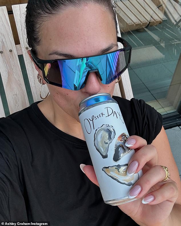 That same day, she also spent time sunbathing and lounging outdoors, as seen in a selfie she took while drinking a canned Oyster Days beverage.