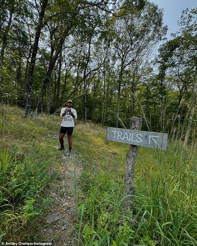 Graham also took some sweet snaps of her husband during their little getaway. In her post, she included a photo of him snapping a photo of her on a hiking trail.