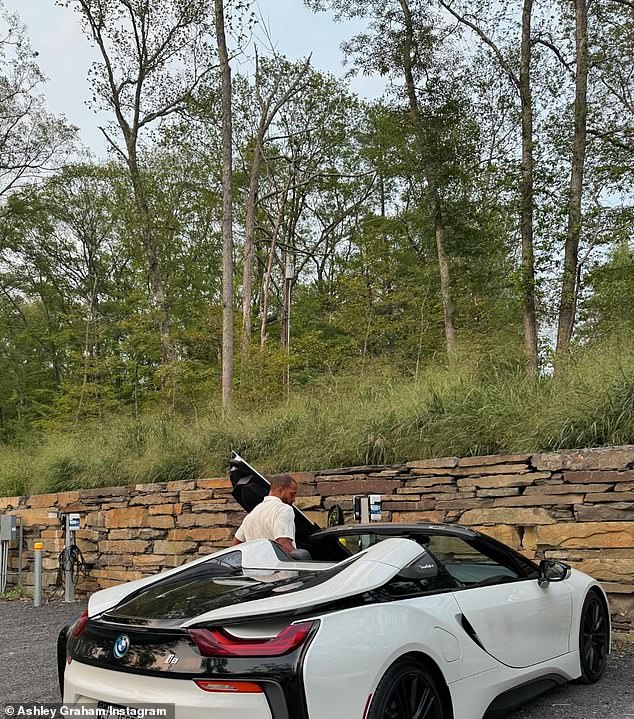 While they enjoyed the outdoors and nature, they did it in style. Graham snapped a photo and shared one of her husband climbing into a flashy BMW.