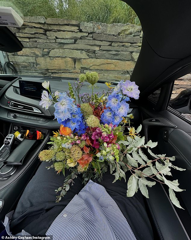 She also took a photo of the lavish flower display Ervin gifted her while she sat in the car as his princess passenger.