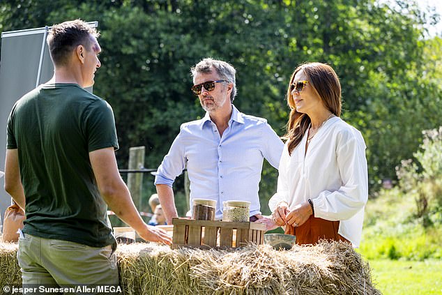 The couple were photographed sampling local produce and talking to small business owners during their tour of the tiny island 105 miles southeast of Copenhagen.