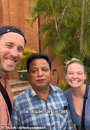 The couple is pictured above with a local in Old Bagan.