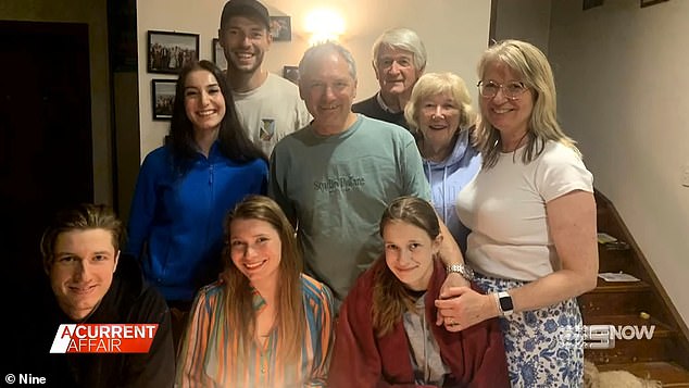 Hannah Friebel's parents, John and Jennie Friebel (pictured, centre right), say the NDIA was relentless in demanding Hannah repay the debt.