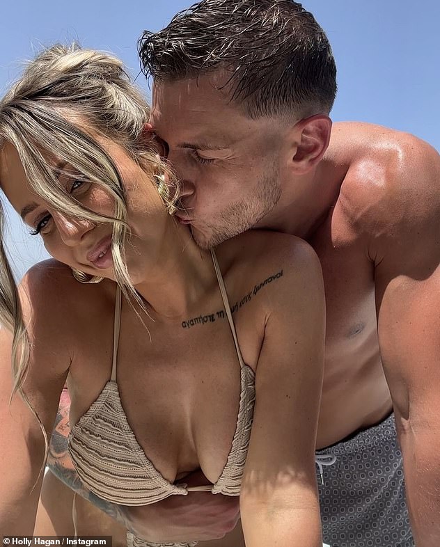 Holly and footballer Jacob, 31, have been married since 2022 (pictured in May. Holly's tattoo reads in Greek: 