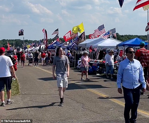 Crooks was filmed as the camera panned around the stall selling politically themed caps and T-shirts to show how busy it was.