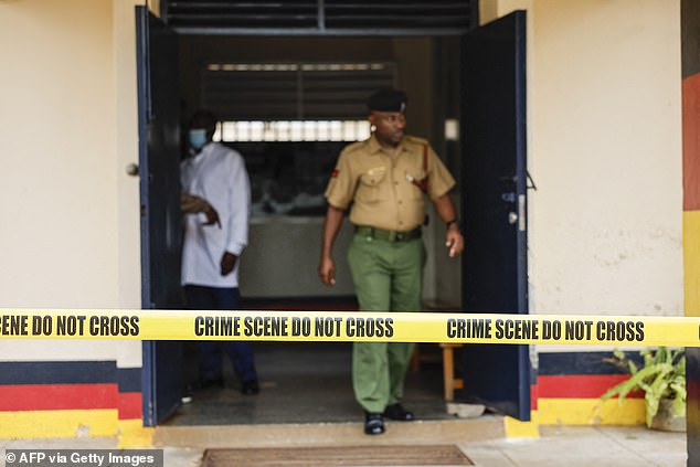 Officers from the criminal detective unit work at the scene at Gigiri police station after the escape.