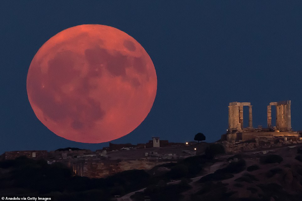 ATHENS: The full moon known as the blue moon rises over the Temple of Poseidon at Cape Sounion, near Athens.