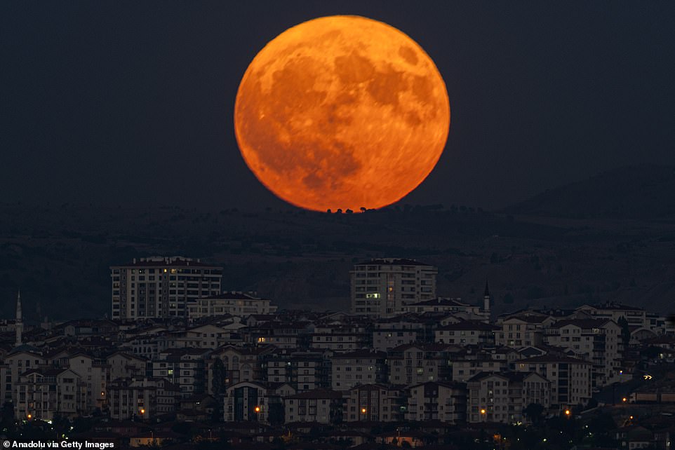 TURKEY: Supermoon rises over buildings in Ankara, Turkey, on August 19. There won't be another one until 2037