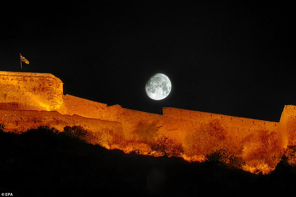 GREECE: The first Supermoon of the year, also known as the Sturgeon Moon, rises over Palamidi Castle in Nafplio, Peloponnese, Greece.