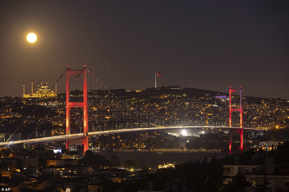 ISTANBUL: The phenomenal moon rises behind the Camlica Mosque and the Martyrs' Bridge in Istanbul, Turkey