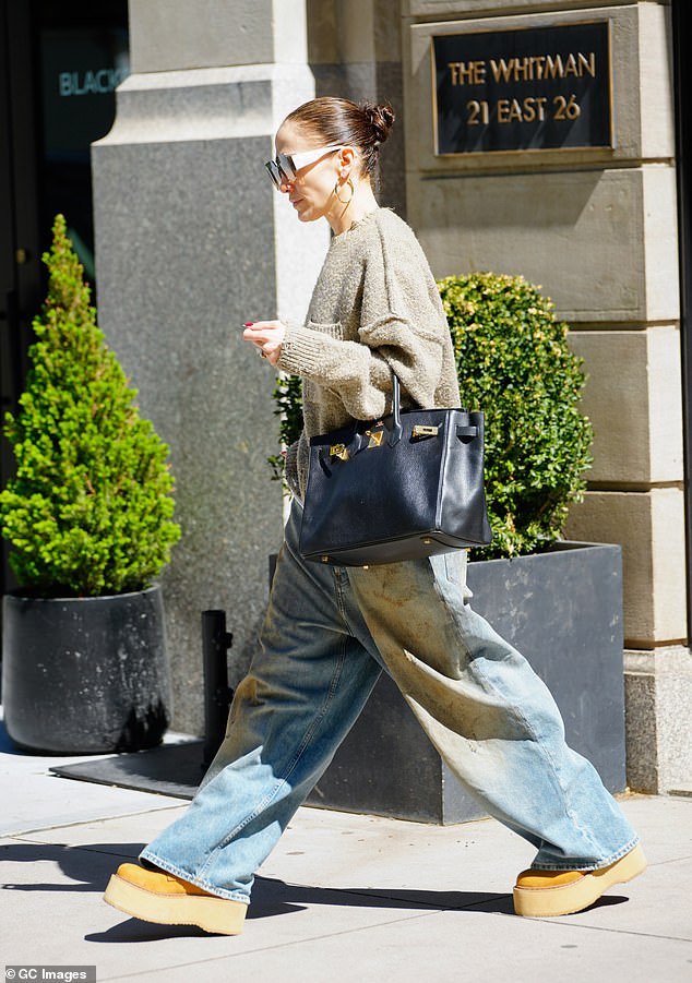 Lopez carried a huge Birkin bag