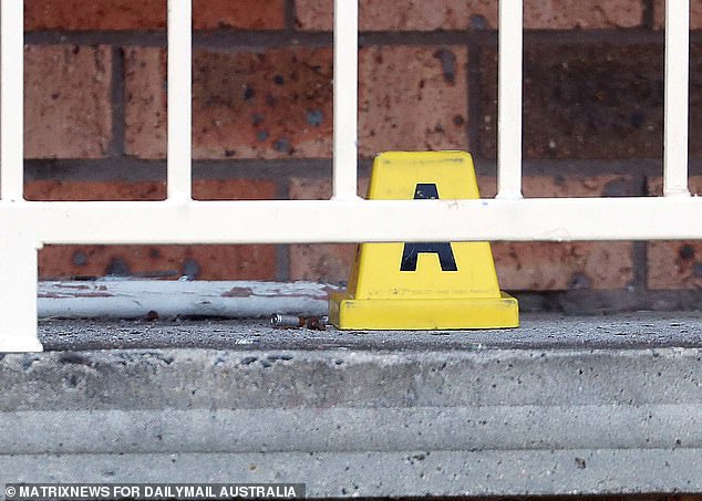 A bullet casing could be seen on the ground outside the house.