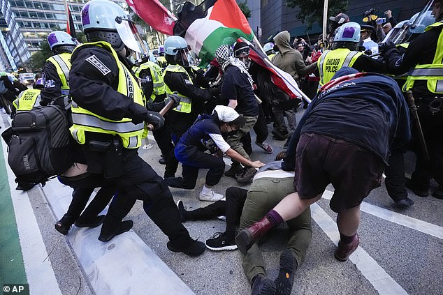 Protesters fell to the ground after clashing with riot police.