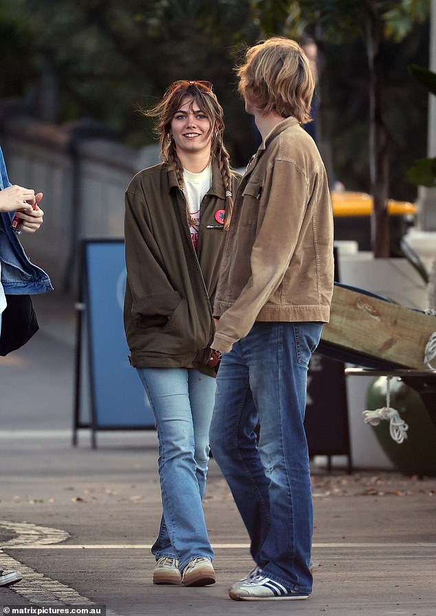 Mia seemed to be in good spirits as she smiled and laughed with her friends.