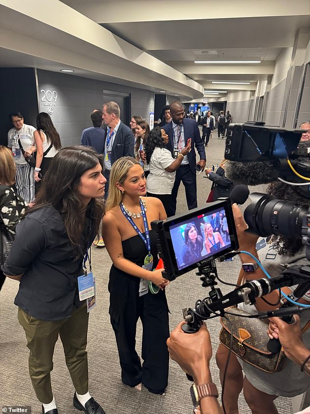 The next day, Claudia posted a video with her mother and father, each sharing their views on the convention. (Pictured: Claudia being interviewed at the Democratic National Convention)