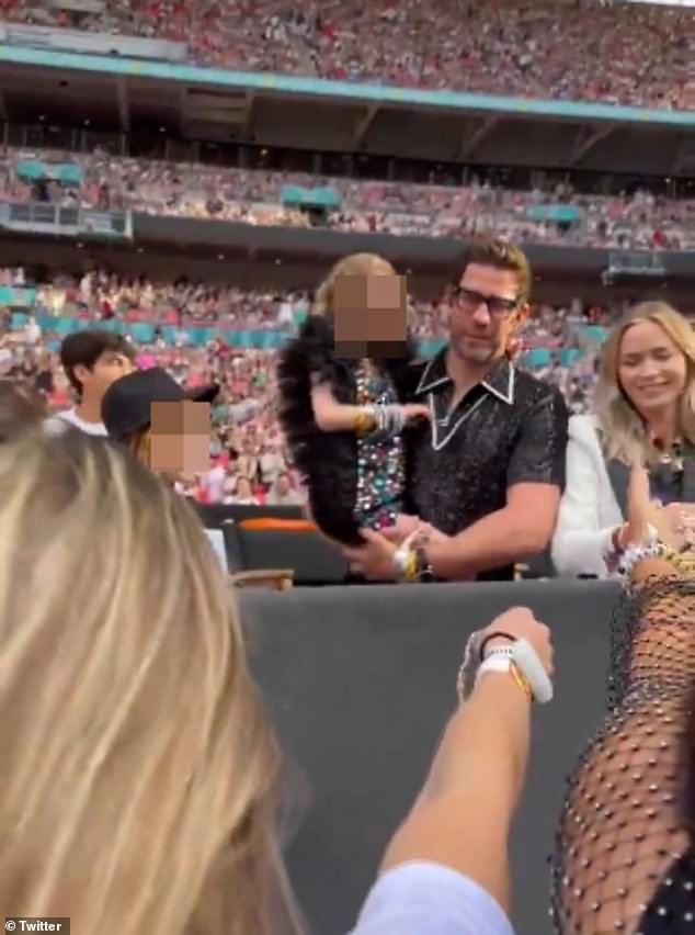 Emily, 41, and John, 44, were joined by their children Hazel, 10, and Violet, seven, as they hung out in the VIP tent.