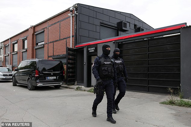 Police officers outside the Tate brothers' residence in Pipera, Ilfov, near Bucharest, Romania, on August 21, 2024