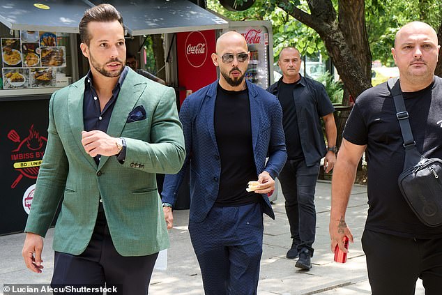 Andrew Tate (center) and his brother Tristan Tate (left) return to the Bucharest court after a break for refreshments. Andrew and Tristan Tate, Bucharest Court, Bucharest, Romania - July 04, 2024