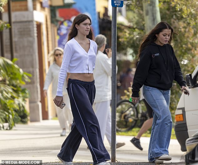 Phoenix (pictured right) was also in casual mode in a dark blue sweater and a pair of relaxed-fit light blue jeans.