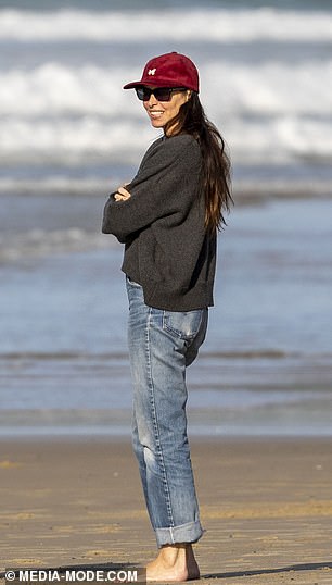 Erica went barefoot on her therapeutic walk on the beach, with her $1,400 sneakers nowhere in sight