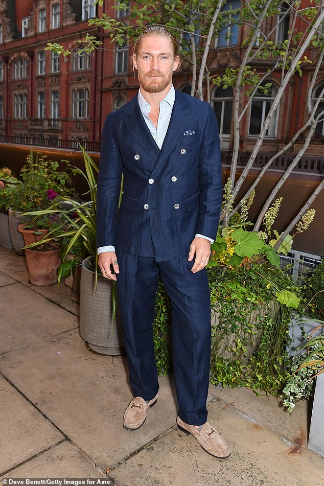 The Gentleman actor Harry Goodwins also looked dapper in a loose-fitting navy double-breasted suit and beige suede loafers as he joined a host of famous faces for the evening.