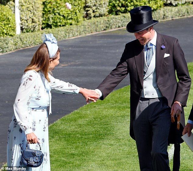 William offers to help his mother-in-law Carole Middleton after her heel gets stuck in the grass at Royal Ascot in June.