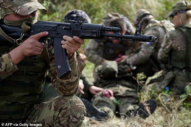 Doctors, volunteers and soldiers receive tactical training, including first aid and simulating the evacuation of a wounded comrade, in the Rostov region in southern Russia.