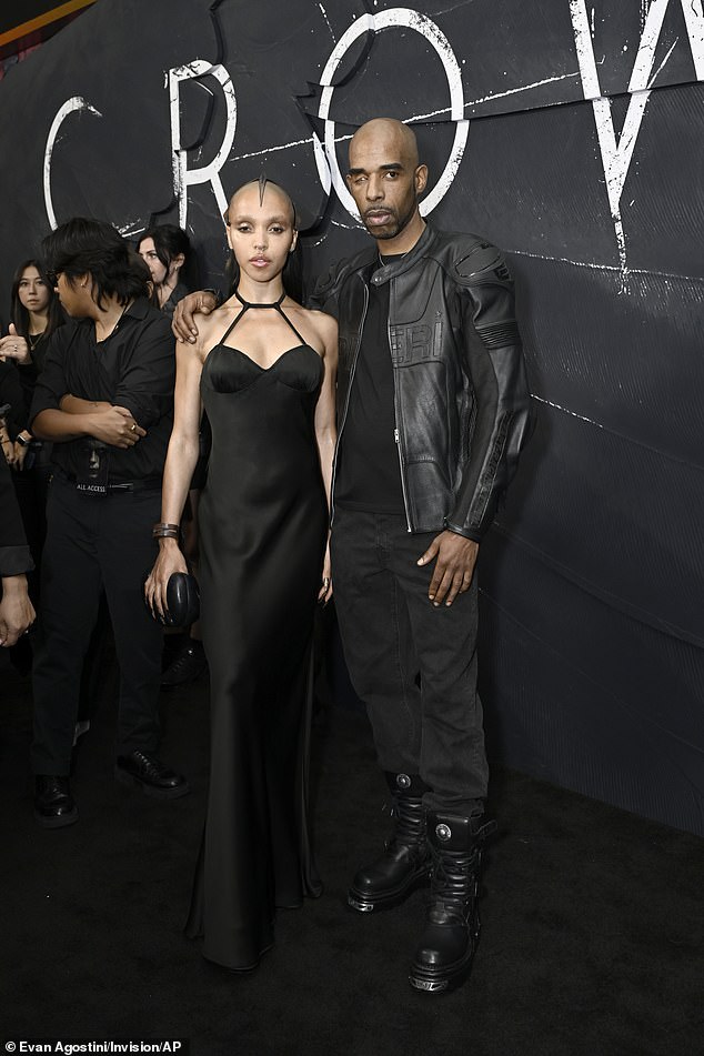 FKA Twigs posed spectacularly with musician Trigga, who cut a casually chic figure in a black leather biker jacket.