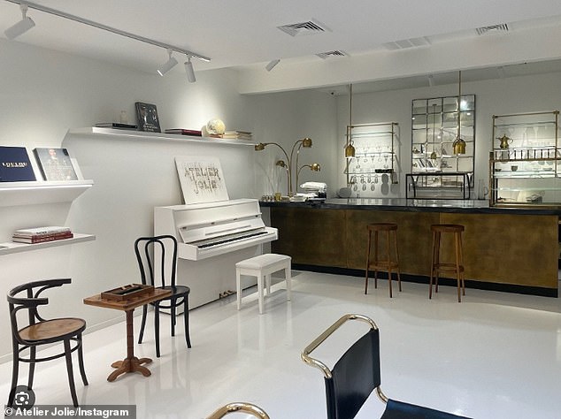 The shop has a piano, chairs and tables, books and a bar.