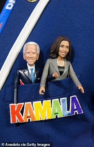 A rainbow Kamala jacket with little dolls of the president and vice president.