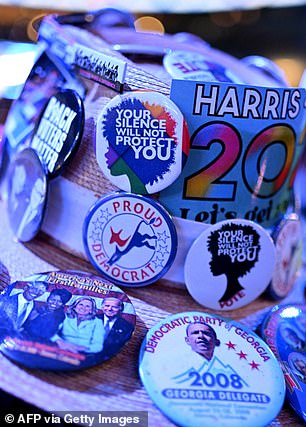 A delegate's hat covered in pins representing Kamala Harris, former President Obama, and President Biden