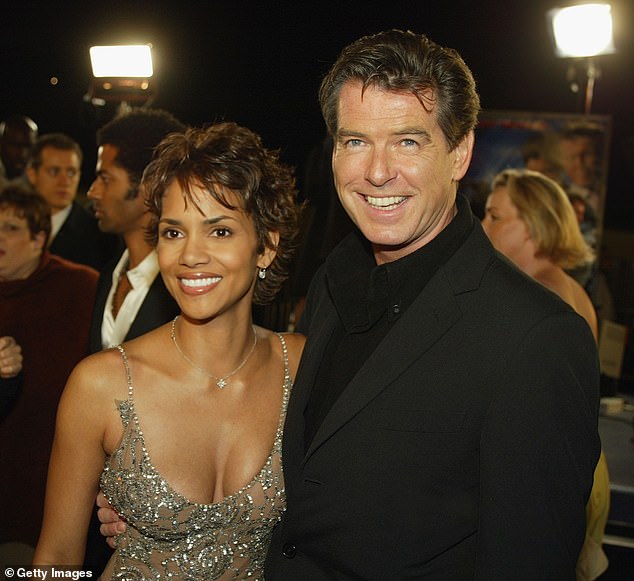 The actress, 58, played Bond girl Jinx in Die Another Day alongside Brosnan, 71 (pictured at the premiere in 2002)