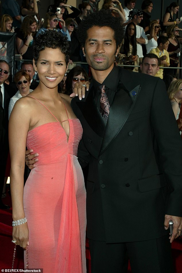 Between 1999 and 2003, Berry dated Eric Benet, whom she had to confront about his infidelity during the filming of Die Another Day in London (photo from March 2003).