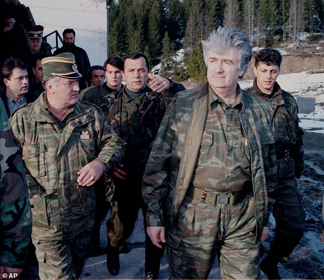 Bosnian Serb wartime leader Radovan Karadzic (second from right) and his general Ratko Mladic (first from left) walk accompanied by bodyguards on the front line of Mount Vlasic in Serbia. FILE - In this April 15, 1995 file photo, Bosnian Serb wartime leader Radovan Karadzic (second from right) and his general Ratko Mladic (first from left) walk accompanied by bodyguards on the front line of Mount Vlasic in Serbia.