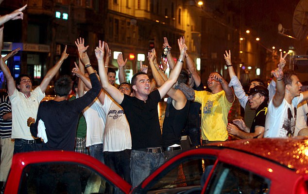 Bosnian Muslims celebrate in Sarajevo after the Serbian president's office announced that Serbian security forces have arrested Bosnian Serb wartime leader Radovan Karadzic, one of two main suspects in war crimes in the Balkans, after 13 years on the run.