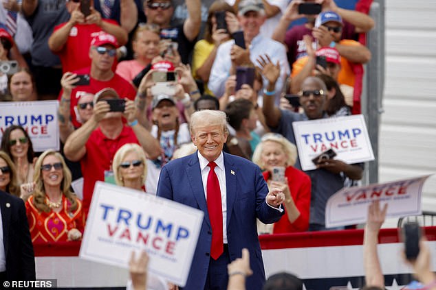 Trump on stage before a supporter's medical emergency