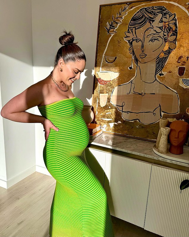 The former Neighbours star was simply radiant as she flaunted her baby bump in a tight-fitting bright green dress.