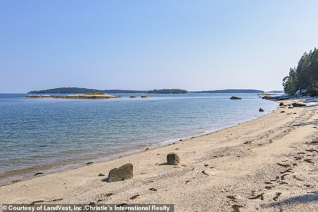 A stone path leads people to the wonderful private beach (pictured) near the house, which is ideal for bonfires, boating, kayaking and searching for sea glass.