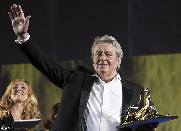 French actor Alain Delon receives a lifetime achievement award during an awards ceremony at the Locarno Film Festival on August 2, 2012