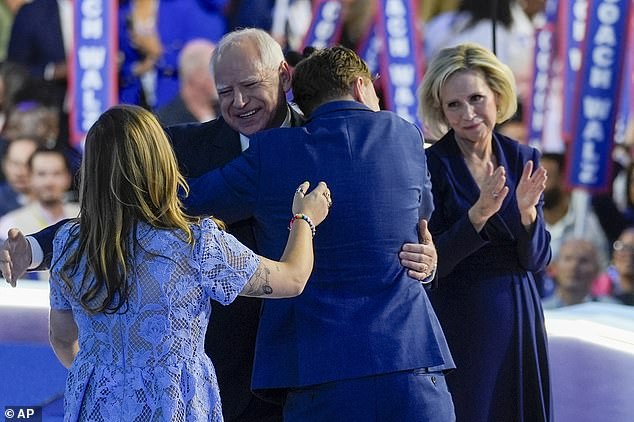 Walz hugged by his son Gus after giving his acceptance speech at the Democratic National Convention