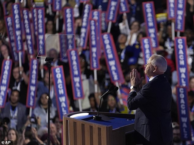 Walz's speech was filled with football metaphors and references to his time as a public school teacher. As he spoke, supporters in the crowd held signs that read: 