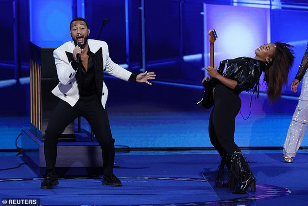 John Legend performing a tribute to Prince at the Democratic National Convention in a nod to Tim Walz's home state of Minnesota