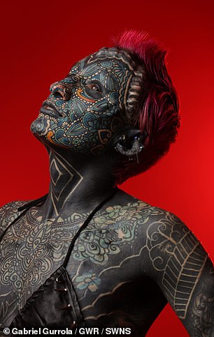 Esperance's first body modification was a 'tongue split' and she later had five facial implants and a wide range of piercings in her ears, nipples, lips and gums.