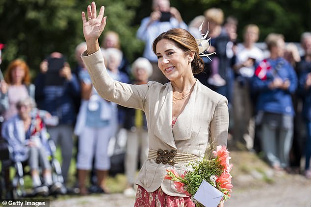 The Australian-born monarch stepped out in Assens with her husband King Frederik on Wednesday as part of the couple's summer tour on the royal yacht Dannebrog.